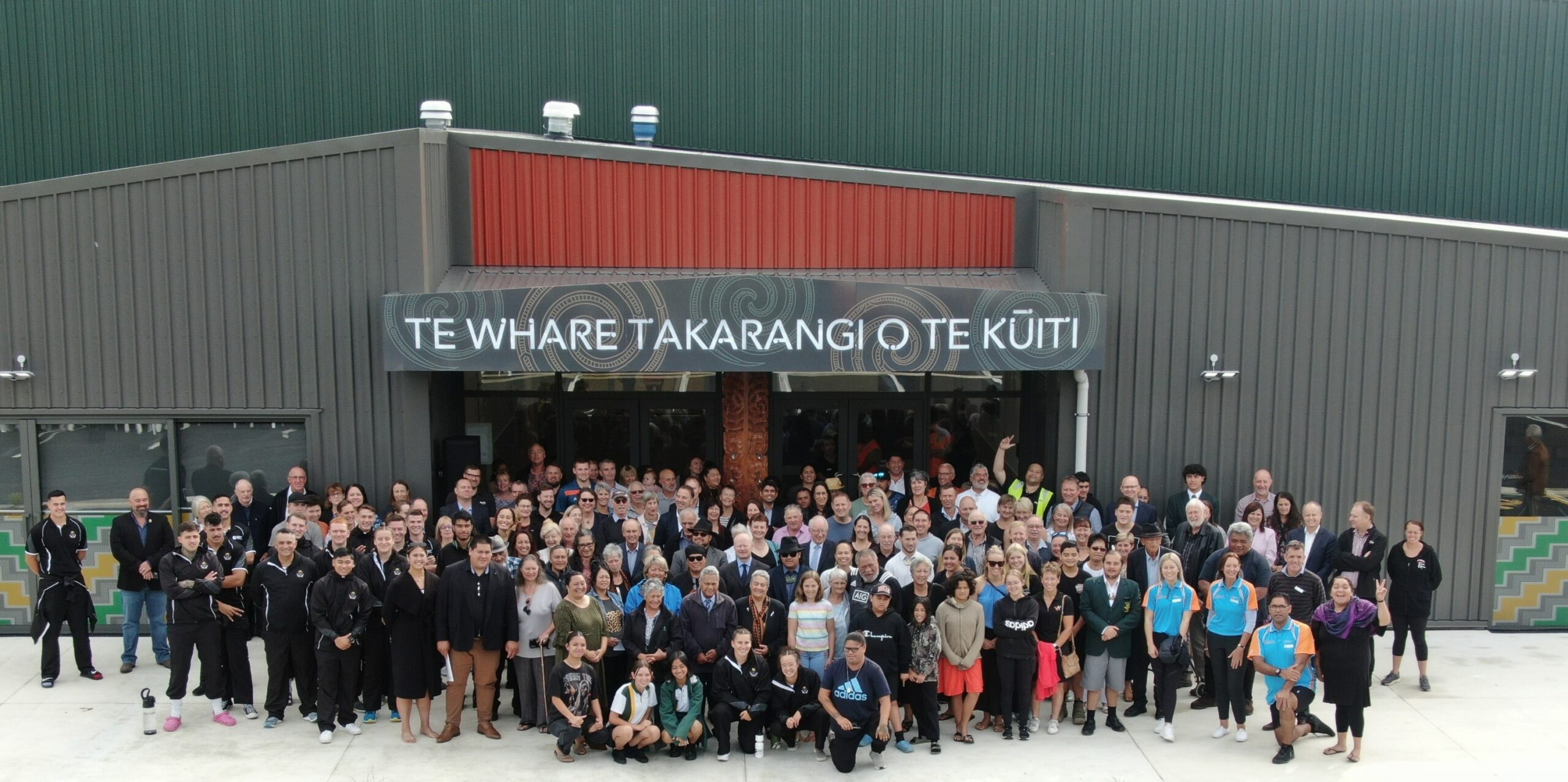 Group of people standing outside the newly opened Te Whare Takarangi o Te Kuuiti.