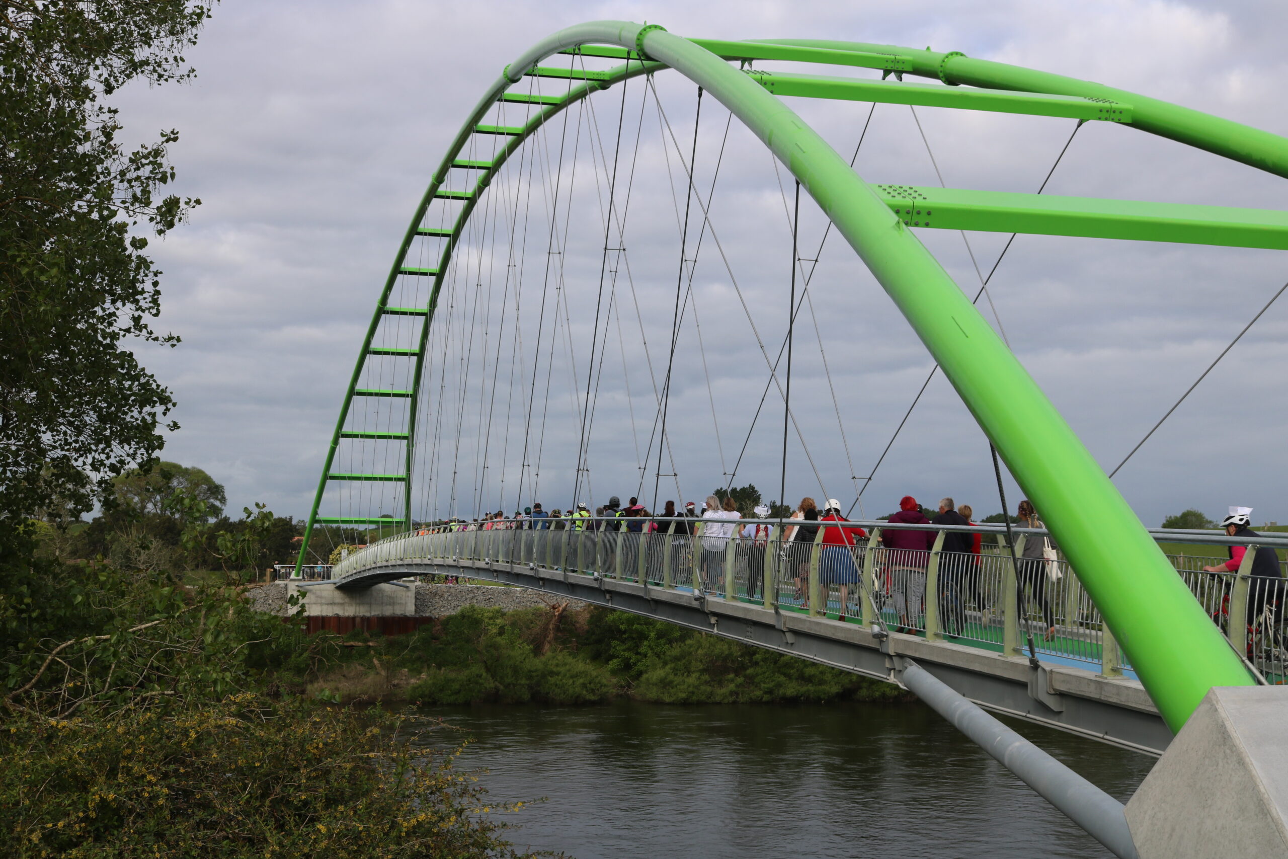 Crowd of cyclists and pedestrians on the Perry Cycle Bridge Te Awa River Ride