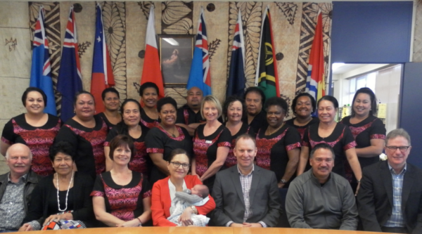 A group of K'aute Pasifika and Trust Waikato staff and trustees smiling