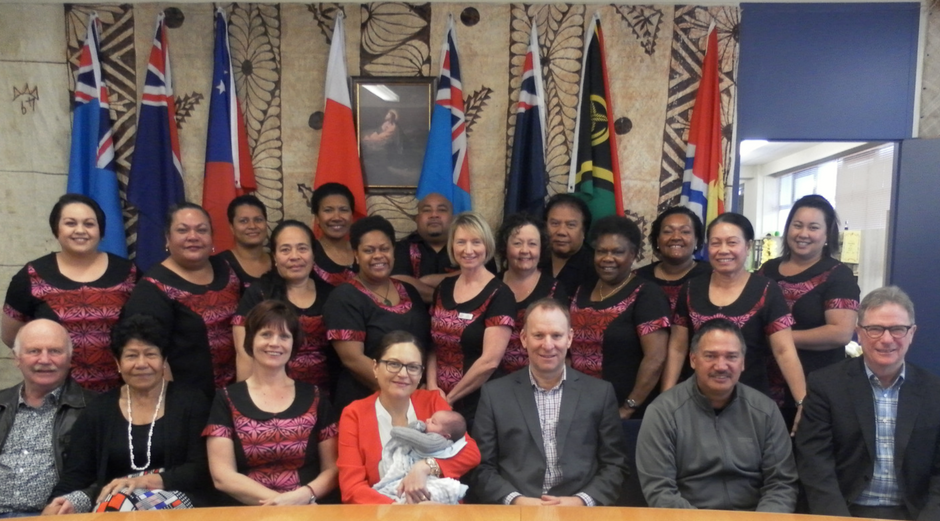 A group of K'aute Pasifika and Trust Waikato staff and trustees smiling