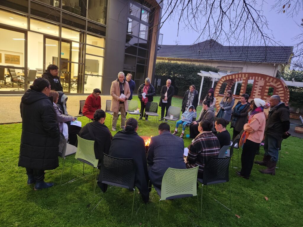 Guests gathered around the fire pit at dawn. 